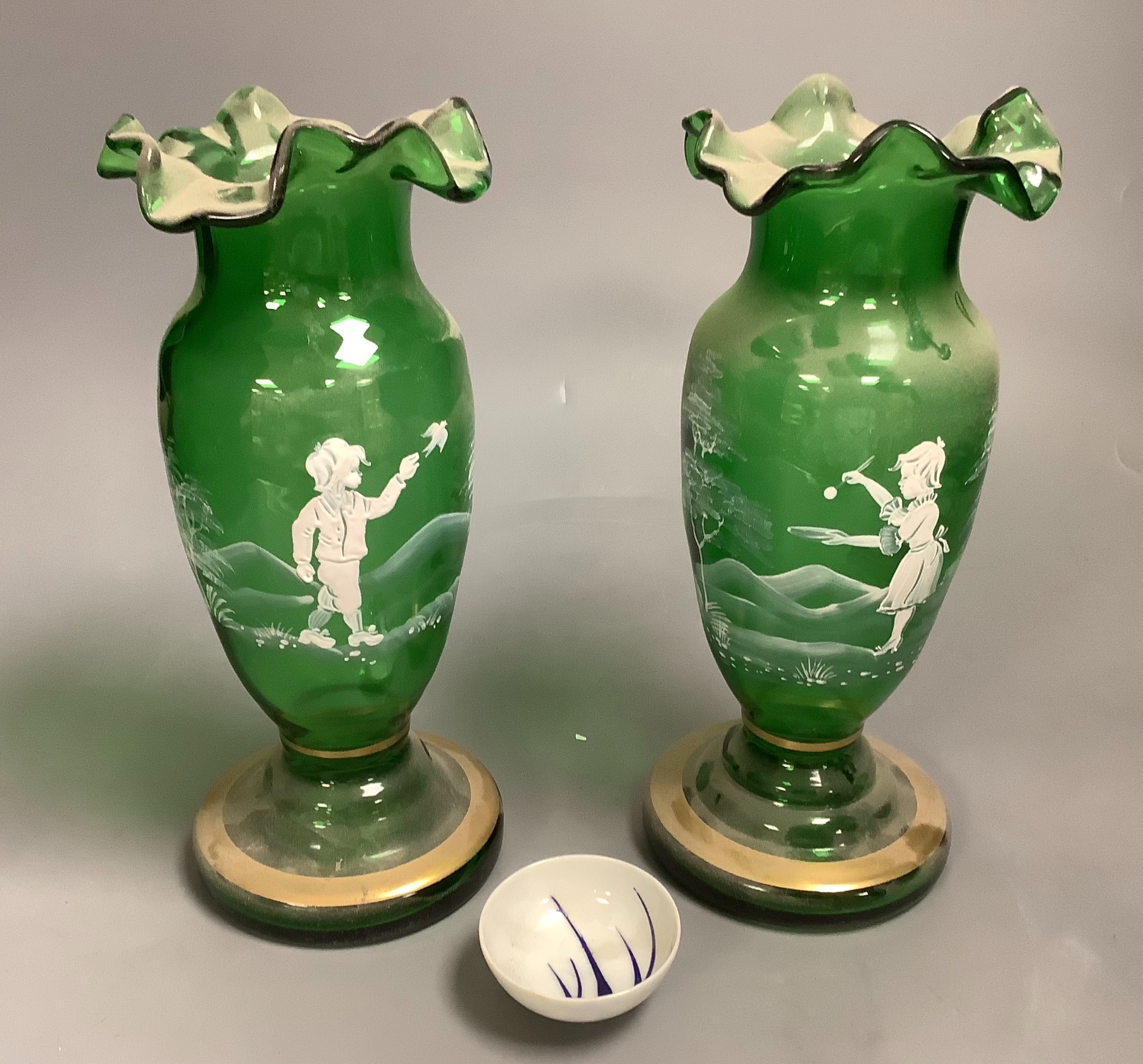 A pair of Mary Gregory style green glass vases and a soy sauce dish